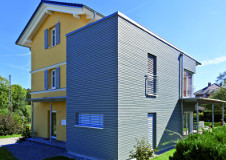 Cape-Cod-graue-Fassade-Rhombusleiste-Kieselgrau