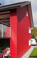 Cape Cod Fassade Granatrot - Architektur: Architekturbüro: Gross Architekten, Wilhelmsdorf